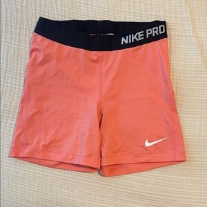 Nike Pro Women's Athletic Shorts in Coral and Black